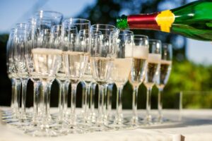 Pouring champagne into champagne flutes